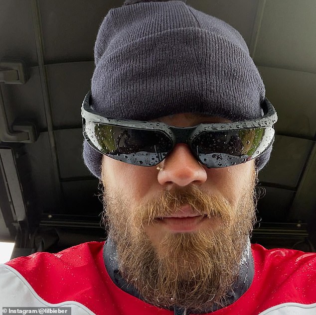 He also swapped his usual attire for a Gleneagles branded rain jacket and a woolly hat and even smiled widely for the camera as he sat in his golf cart