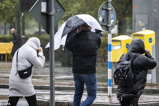 Storm Amy is beginning to wreak its havoc on the people of Malmo, Sweden with strong winds and sweeping rain