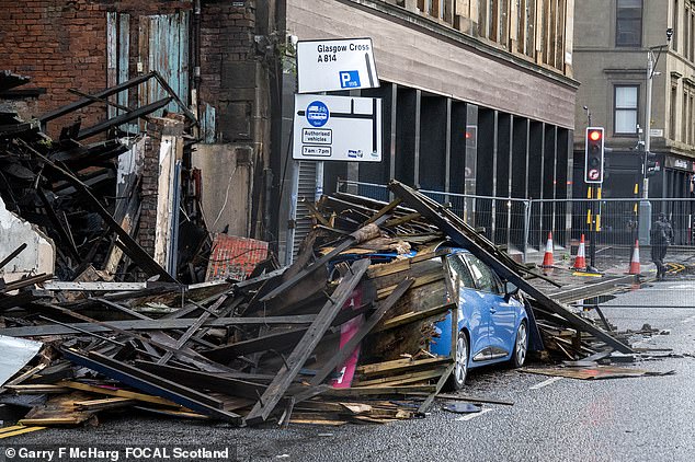 A building collapsed in Broomielaw, in Glasgow Scotland, covering a car in debris