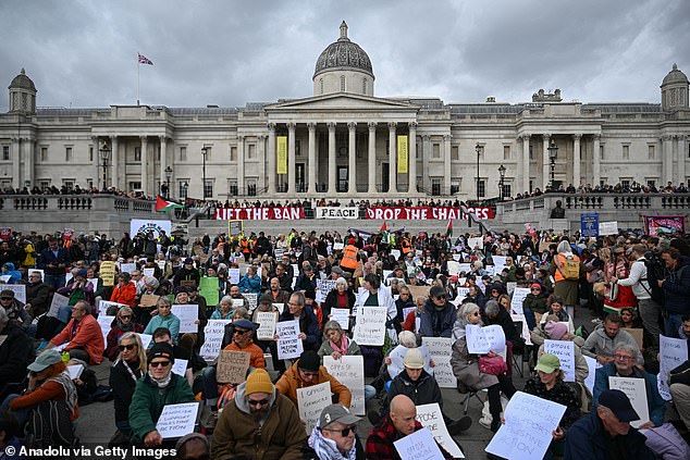 People stage a protest to demand the British government to lift its ban on Palestine Action in Trafalgar Square on Saturday, October 4