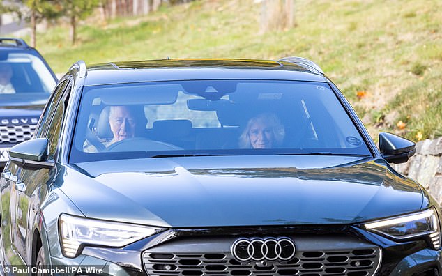 The royal couple were seen arriving side by side in their Audi, with Charles behind the wheel and waving to passers by, with Camilla beamed from the passenger seat