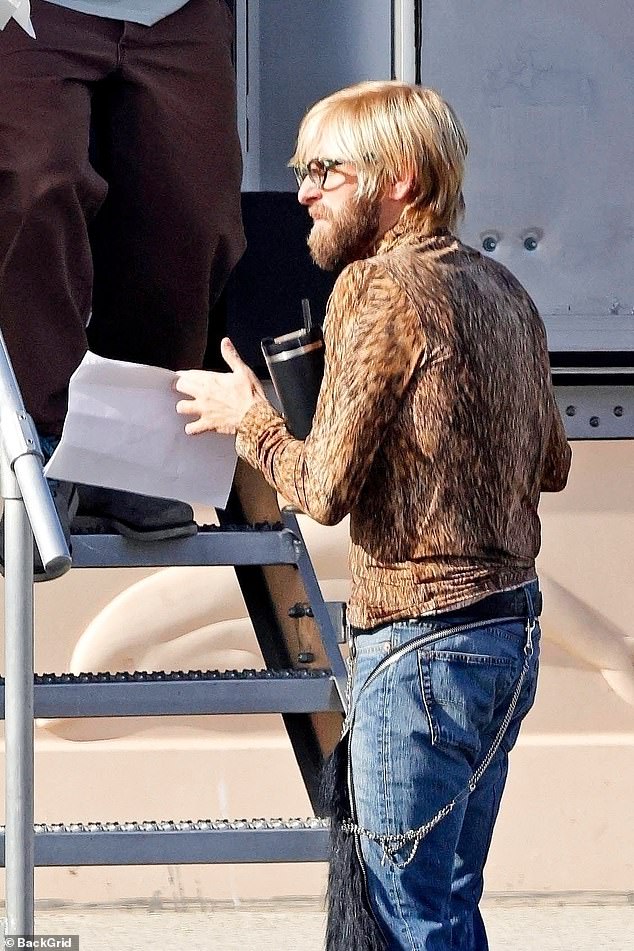 The star looked almost unrecognizable as he stepped out in character wearing a tight leopard-print top that accentuated his noticeably slimmer frame