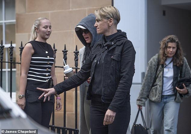 Donning gym attire, Katy sported a pair of brown skin-tight leggings and stayed warm in the chilly weather with a huge cream coat.