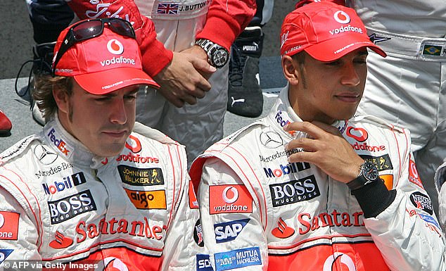 Fernando Alonso (left) tried to give McLaren staff £1000 each during  his first season racing against new team-mate Lewis Hamilton (right), pictured in 2007 in Brazil