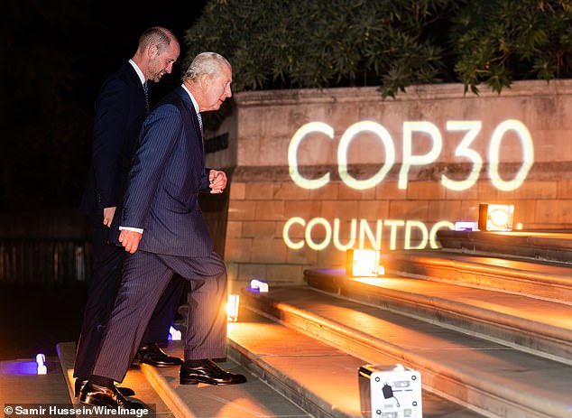 King Charles and Prince William walking up the steps to enter the Natural History Museum together