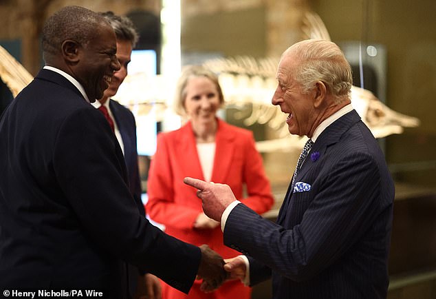 King Charles speaking with the Deputy Prime Minister and Justice Secretary David Lammy and Energy Secretary Ed Miliband