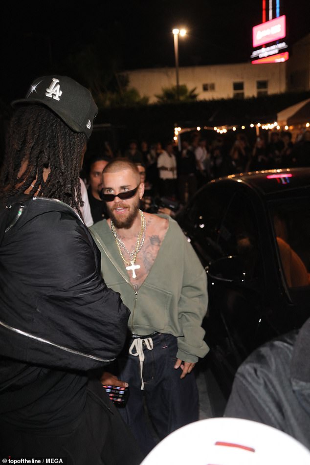 Justin was greeted by his friends outside his car