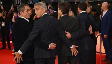 George Clooney showed he hasn't lost his mischievous side as he put on a cheeky display at the star-studded London premiere of his new Netflix film Jay Kelly on Friday evening (L-R David Heyman, George, Noah Baumbach, and Adam Sandler)
