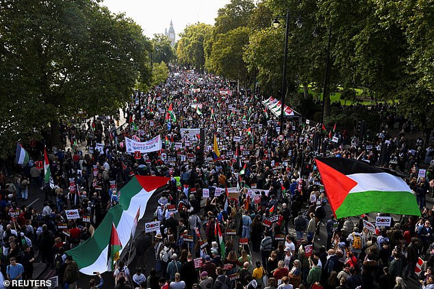 Demonstrators from the 'Palestine Coalition' gather in support for Palestinians, after a ceasefire between Israel and Hamas in Gaza went into effect, in London today