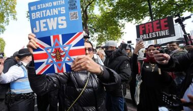 A demonstrator from Our Fight, a pro-Israel organisation, is seen in the crowd among pro-Palestinian supporters, ahead of a Palestine Solidarity Campaign march from Victoria Embankment to Downing Street, central London