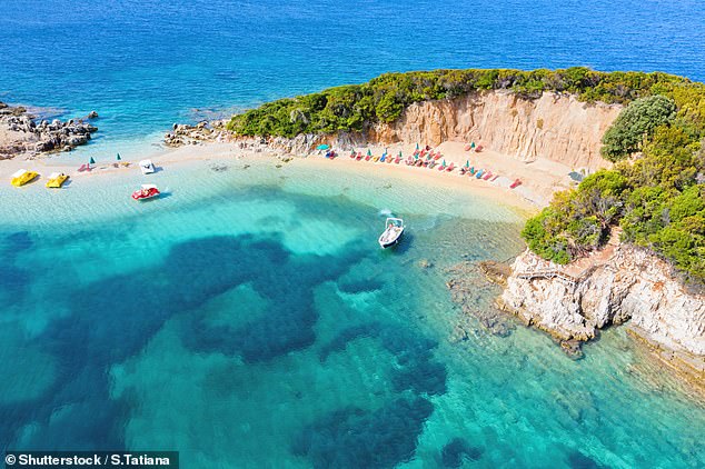 Albania’s sandy beaches and blue waters, like these in Ksamil, are a magnet for tourists