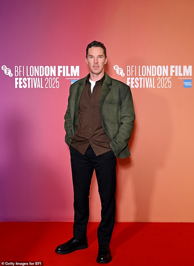 He teamed the look with a chocolate brown button-up shirt layered over a white vest top, paired with smart black trousers