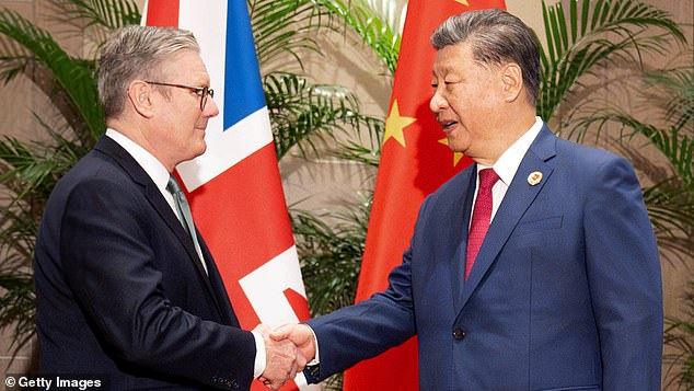 UK Prime Minister Sir Keir Starmer shakes hands with President Xi Jinping of China while the two leaders were in Rio de Janeiro to attend the G20 summit on November 18, 2024