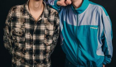 Leaning on one another, with huge smiles, Dan Howell and Phil Lester look like the perfect, happy couple