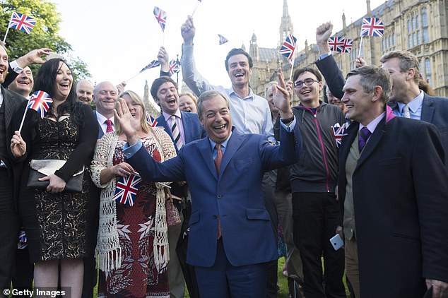 Flying the flag: Nigel Farage celebrates with supporters after Britain voted to leave the EU in June 2016