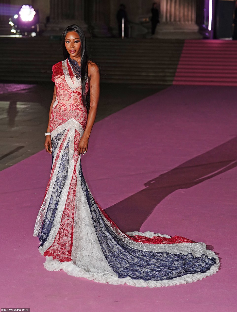 Naomi's dramatic featured a huge lace lined train and a sheer overlay, as well as a sweeping drape neckline