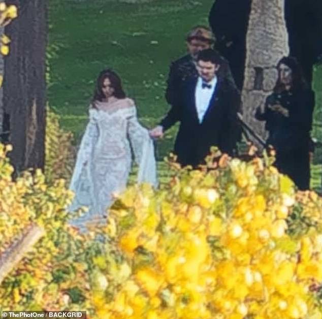 Her beau, for his part, looked dapper in a classic black tuxedo, which was paired with a white dress shirt and black bowtie for the big day
