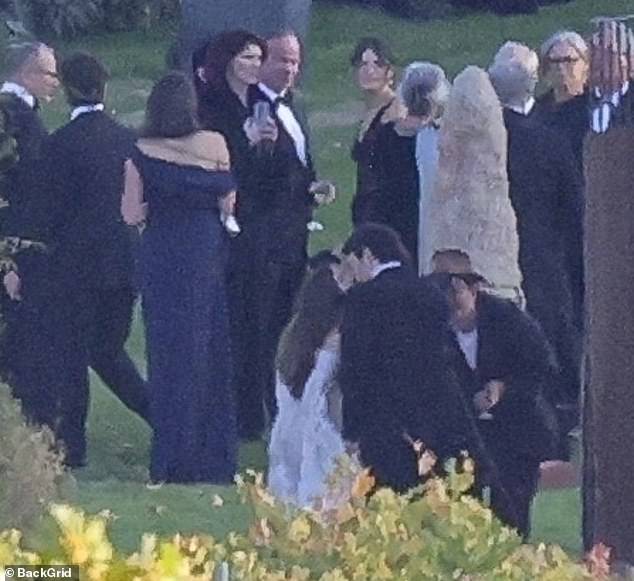 The newlyweds shared a sweet kiss at one point