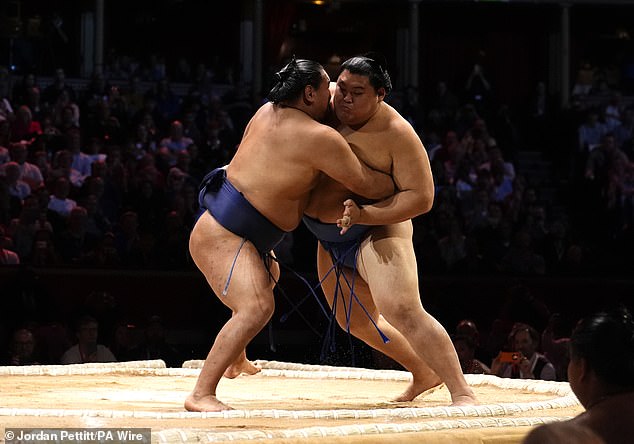 Hoshoryu (right), 25, sealed victory by defeating fellow grand champion Onosato in the deciding bout to finish the event with a perfect 5–0 record