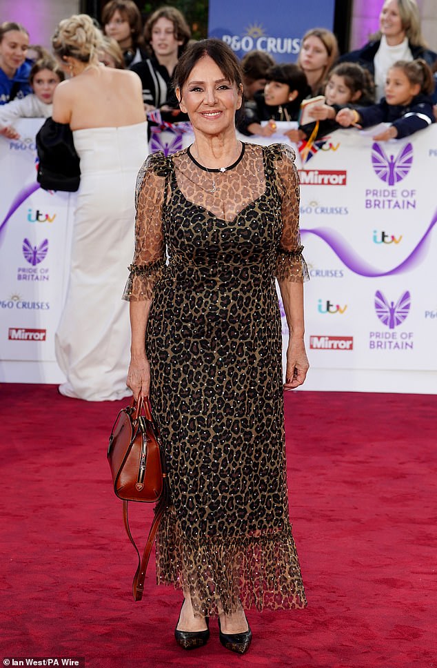 Former Strictly Come Dancing judge Arlene Phillips cut a chic figure in a leopard print dress with silver diamante detailing
