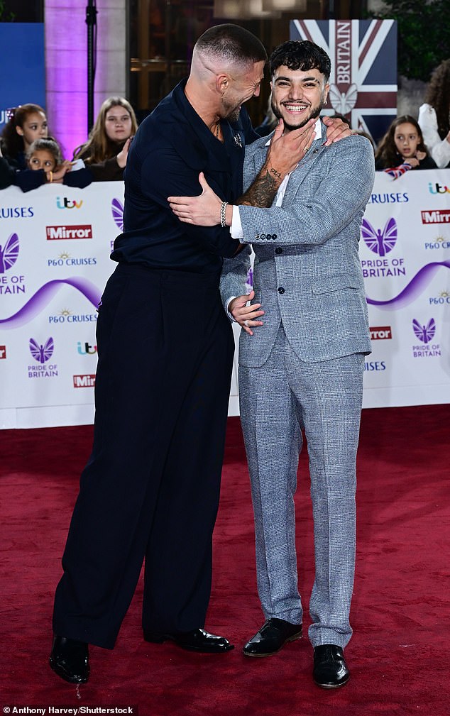 Dressed in a sharp pale blue suit, Junior was seen mingling with presenter Jake Quickenden on the red carpet