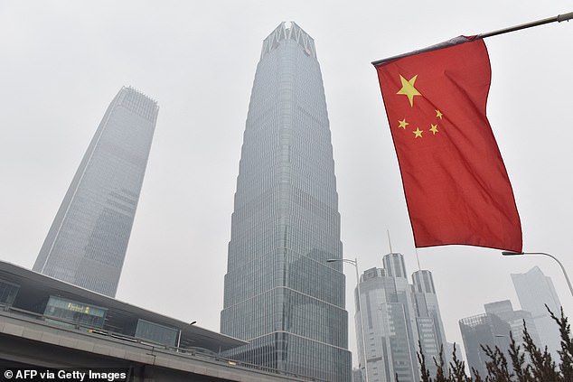 Slowdown: Official figures showed Chinese output rose at an annual rate of 4.8% in the third quarter of the year, down from 5.2% in the previous three months