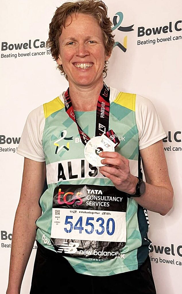 Alison Crooks shows off her medal after completing the London marathon in 2023 to raise money for charity Bowel Cancer UK