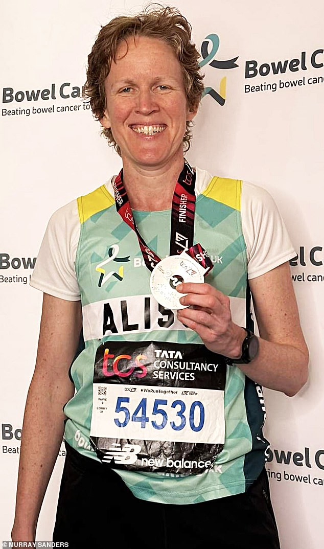 Alison Crooks shows off her medal after completing the London marathon in 2023 to raise money for charity Bowel Cancer UK