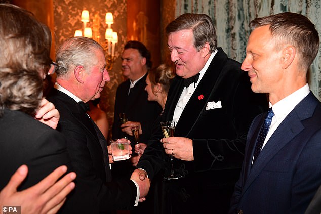 Charles talks to Stephen Fry as he attends a concert at Buckingham Palace in October 2018