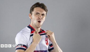 Rob Hawkins looks at the camera and celebrates