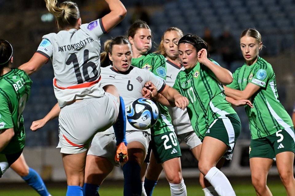 Northern Ireland’s Joely Andrews jostles with Iceland counterpart Ingibjörg Sigurdardóttir in Ballymena
