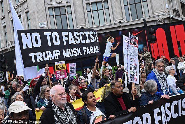 Anti-Trump protesters take part in a march during a demonstration against the second State Visit of US President Donald Trump in central London on September 17, 2025. Donald Trump was welcomed by King Charles III to Windsor Castle Wednesday with a royal spectacle featuring gun salutes, mounted horses and bagpipes as the US president's historic second state visit got into full swing. (Photo by JUSTIN TALLIS / AFP) (Photo by JUSTIN TALLIS/AFP via Getty Images)