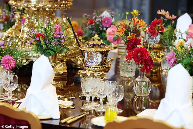WINDSOR, ENGLAND - SEPTEMBER 17: The table setting for the state banquet for the state visit by the President of the United States of America at Windsor Castle on September 17, 2025 in Windsor, England. President Trump is in England from Sept. 16-18 on his second UK state visit, with the previous one taking place in 2019 during his first presidential term. (Photo by Anna Moneymaker/Getty Images)