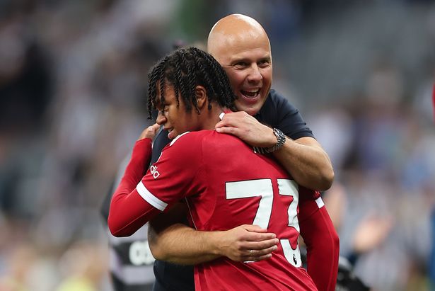 Rio Ngumoha embraces Arne Slot