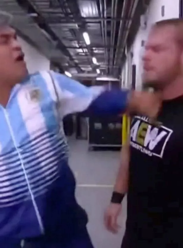 The pair are then seen scrapping backstage