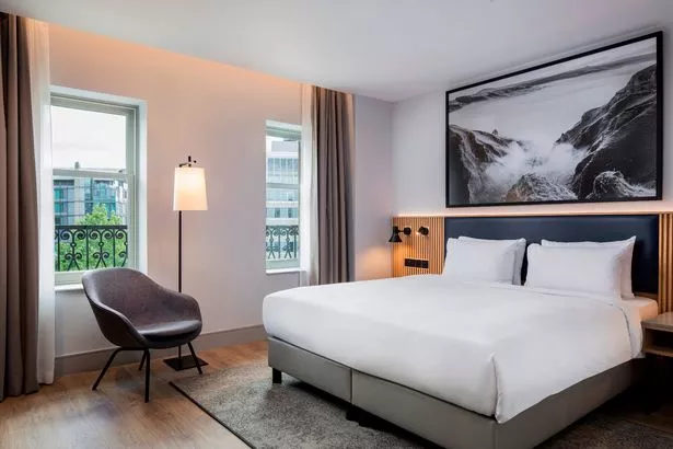 Façade rooms overlook the city and the Town Hall