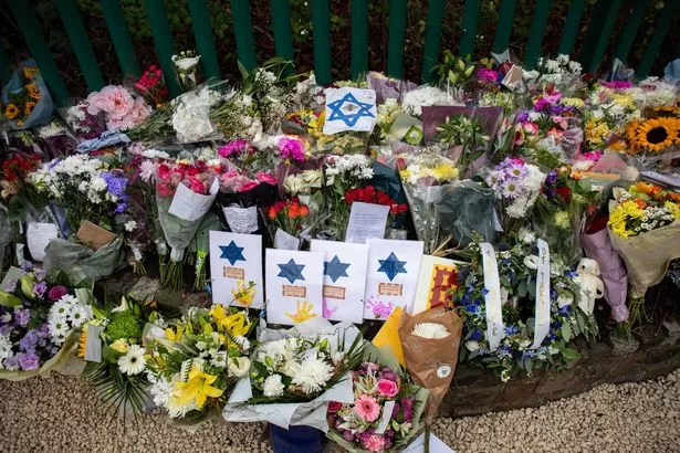 Floral tributes outside of the Heaton Park Hebrew Congregation Synagogue 