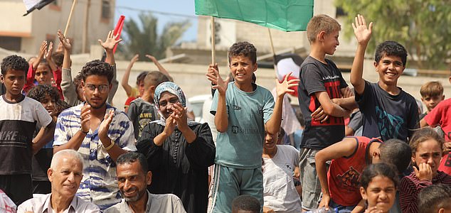 Mandatory Credit: Photo by Hassan Al-Jadi/UPI/Shutterstock (15525839i) Palestinians carrying Palestinian and Egyptian flags celebrate in the Gaza Strip after news of a new ceasefire agreement in Deir al-Balah on October 9, 2025. On the same day, Israel and Hamas reached a deal to release the remaining living hostages-a major step toward ending a war that has claimed tens of thousands of lives and triggered a humanitarian catastrophe. Palestinians Celebrate in Gaza Following News Of a New Gaza Ceasefire Deal, Deir Al-Balah, Palestinian Territories - 09 Oct 2025