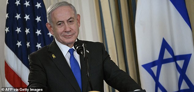 (FILES) Israeli Prime Minister Benjamin Netanyahu participates in a press conference with US President Donald Trump in the State Dining Room of the White House in Washington, DC on September 29, 2025. US President Donald Trump said on October 8, 2025 that Israel and Hamas had agreed on the first phase of his Gaza peace plan, hailing it as a "historic and unprecedented" step to ending the two-year-old war. Palestinian militant group Hamas would release all hostages while Israel would pull its troops back to an agreed on line, Trump said after talks in Egypt on his 20-point peace plan resulted in a deal. (Photo by ANDREW CABALLERO-REYNOLDS / AFP) (Photo by ANDREW CABALLERO-REYNOLDS/AFP via Getty Images)