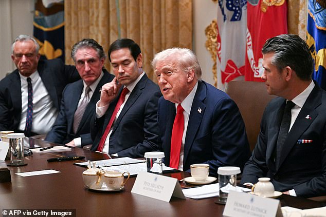 US President Donald Trump speaks, alongside L/R Secretary of Health and Human Services Robert F. Kennedy Jr., Secretary of the Interior Doug Burgum, Secretary of State Marco Rubio, and Secretary of Defense Pete Hegseth, during a cabinet meeting in the Cabinet Room of the White House in Washington, DC, on October 9, 2025. Trump said Thursday he would try to go to Egypt for the signing of a Gaza ceasefire and hostage release deal between Israel and Hamas. (Photo by Jim WATSON / AFP) (Photo by JIM WATSON/AFP via Getty Images)