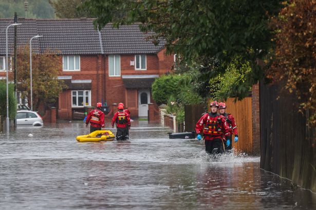 Emergency services help residents during flooding on Bulwer Street in Seaforth, September 2024