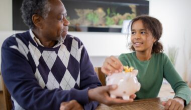 Grandfather teaches his granddaughter healthy saving habits stock photo