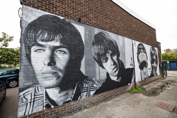 The mural of Liam and Noel is inspired by original photographs taken by Jill Furmanovsky