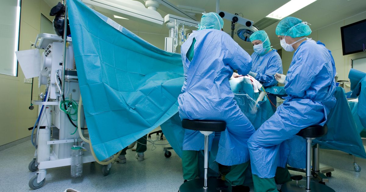 Surgical team performing brain surgery.