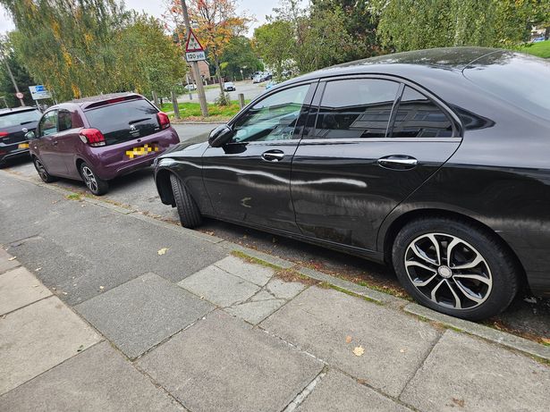 The cars spray-painted on Woolton Road in Garston