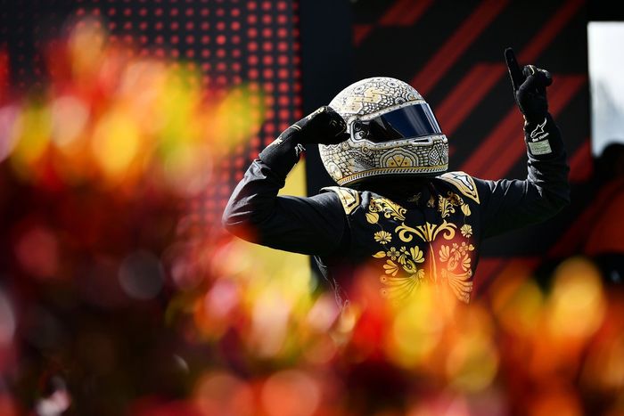 Mario Achi looks on in the Paddock