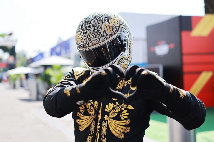 Mario Achi looks on in the Paddock