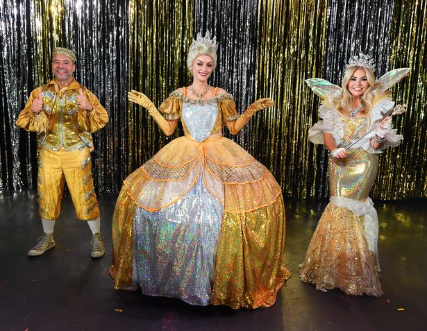 Coronation Street's Katie McGlynn as Cinderella(centre),with Kevin Duala as Buttons and Leanne Campbell as The Fairy Godmother in Cinderella.
