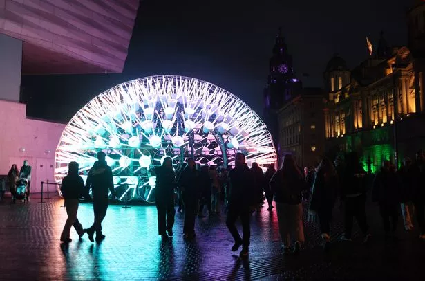 Crowds enjoying the River of Light installations on Liverpool Pier Head last night