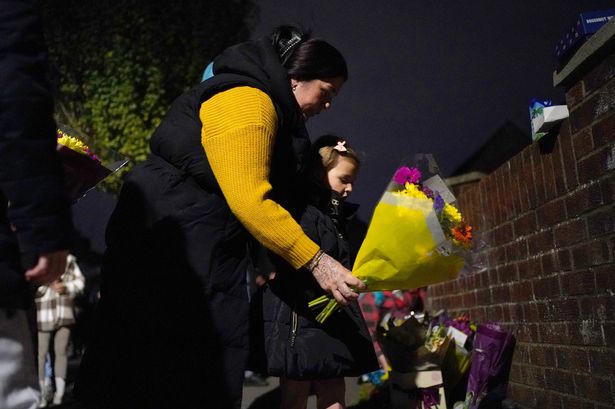 People lay flowers near Midhurst Gardens